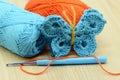 Crocheting butterfly with crochet hook and wool.