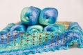 Crocheting in blue and green tones and skeins piled together Royalty Free Stock Photo