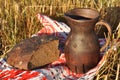 A crock of milk and a half loaf of rye bread Royalty Free Stock Photo