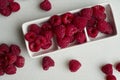 Crockery with beautiful tempting raspberries Royalty Free Stock Photo