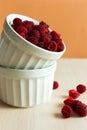 Crockery with beautiful tempting raspberries. Royalty Free Stock Photo