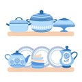 Crockery ceramic cookware. Blue porcelain bowls, plates, teapot and pand on the wood shelfs