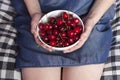 The Crockery with cherries in woman hands Royalty Free Stock Photo