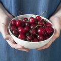 The Crockery with cherries in woman hands Royalty Free Stock Photo