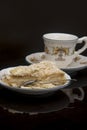Crockery, cup and portion of Napoleon cake