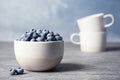 Crockery with juicy and fresh blueberries