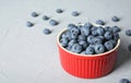 Crockery with juicy and fresh blueberries