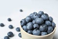 Crockery with juicy and fresh blueberries