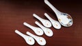 crockery spoon on brown background