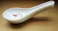 crockery spoon on brown background