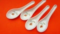 crockery spoon isolated on orange background