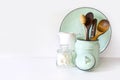 Crockery, tableware, utensils and other different white and turquoise stuff on white table-top. Kitchen still life as background f Royalty Free Stock Photo