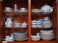 Crockery in wooden kitchen cabinet Royalty Free Stock Photo