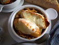 Crocks of french onion soup with toasted bread and melted cheese Royalty Free Stock Photo