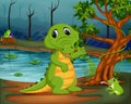 Crocodile and frog in the jungle with lake scene Royalty Free Stock Photo