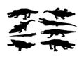 Crocodile silhouette on the white background. Alligator silhouette. Cayman silhouette. Alligator silhouette. Hungry beast.