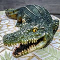Crocodile Statue on a Mosaic Leaf Table Royalty Free Stock Photo
