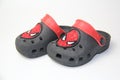 Crocs, colorful children\'s slippers with the design of the spider-man on a white background, space for text. Sao Paulo,