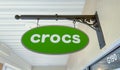 Crocs store sign at the entrance of store in Howell, MI. Crocs is an international casual footwear brand