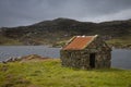 Crofters Hut next to a Loch Royalty Free Stock Photo