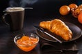Croissant and apricot jam