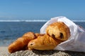 Croissant on the beach Royalty Free Stock Photo