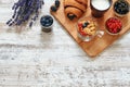 Croissant, berries, cornflakes and cup of milk on a wooden table. Royalty Free Stock Photo