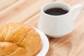 Croissant And Black Coffee Hot Morning Beverage Or Break Time. Royalty Free Stock Photo