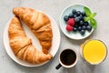 Croissant, black coffee, orange juice and fresh berries Royalty Free Stock Photo