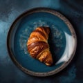 Croissant On A Blue Abstraction Round Plate, French Dinners. Generative AI