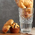 Croissant brad muffin bakery in glass blow on teakwood table