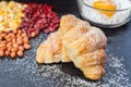 Croissant Bread , Fresh egg in flour and Peanuts and red lentils and corn on black wood chalkboard. Royalty Free Stock Photo