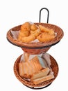 Croissant and bread in two wooden baskets. on an isolated white background Royalty Free Stock Photo