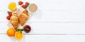 Croissant breakfast croissants orange juice coffee food wooden board from above copyspace copy space banner