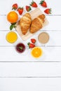 Croissant breakfast croissants orange juice coffee food wooden board from above copyspace copy space portrait format Royalty Free Stock Photo