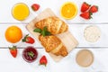 Croissant breakfast croissants orange juice coffee food wooden board from above Royalty Free Stock Photo