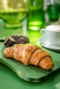 Croissant in a breakfast setting Royalty Free Stock Photo