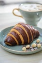 Croissant in a breakfast setting Royalty Free Stock Photo