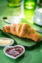 Croissant in a breakfast setting Royalty Free Stock Photo