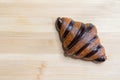 Croissant for breakfast on wooden background in coffee shop Royalty Free Stock Photo