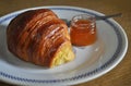 Croissant, Briochem sweet bun with small jar of apricot jam