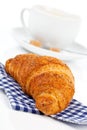 Croissant with caffee cup. Royalty Free Stock Photo