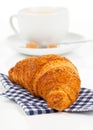 Croissant with caffee cup. Royalty Free Stock Photo