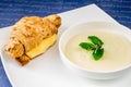 Croissant with cheese and porridge with mint Royalty Free Stock Photo