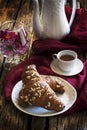 Croissant and coffee with coffee pot and plate