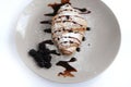 Croissant cowered by chocolate and powdered sugar wiyj blackberries on plate Royalty Free Stock Photo