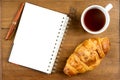 Croissant cup coffee white book pen on teak wood Royalty Free Stock Photo