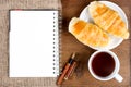 Croissant cup coffee white book pen Royalty Free Stock Photo