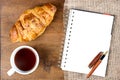 Croissant cup coffee white book pen Royalty Free Stock Photo