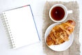 Croissant cup coffee white book table Royalty Free Stock Photo